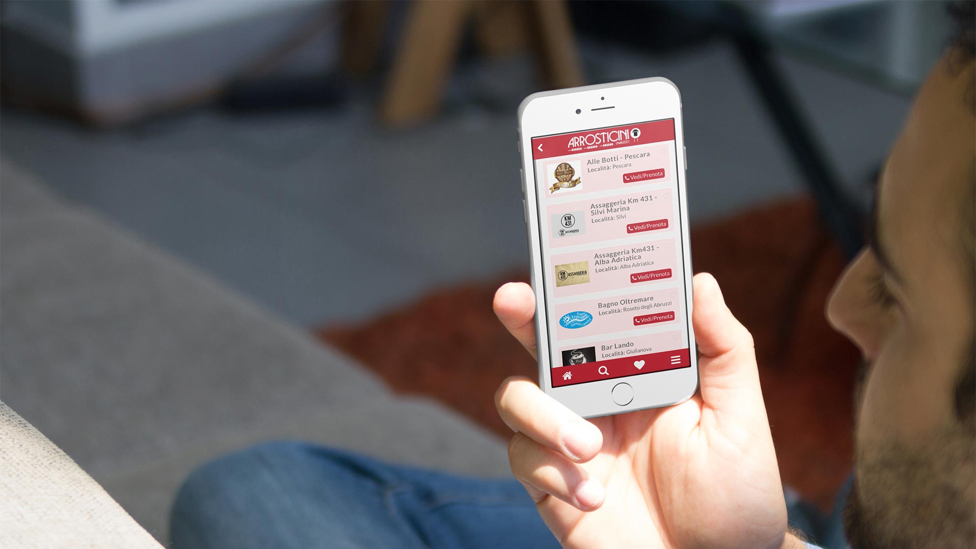 Elenco dei ristoranti nell'app Arrosticini d'Abruzzo visualizzato su smartphone