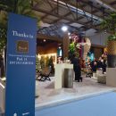 Pannello di ringraziamento accanto allo stand Bruco in fiera