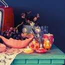 Composizione autunnale con frutta, zucche, candele e fiori