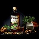 Foto ambientata per e-commerce Scuppoz bottiglia amaro spezie cannella semi erbe